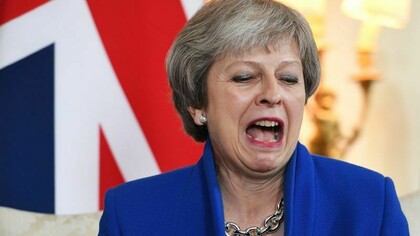 British Prime Minister Theresa May reacts during a meeting at 10 Downing Street in London