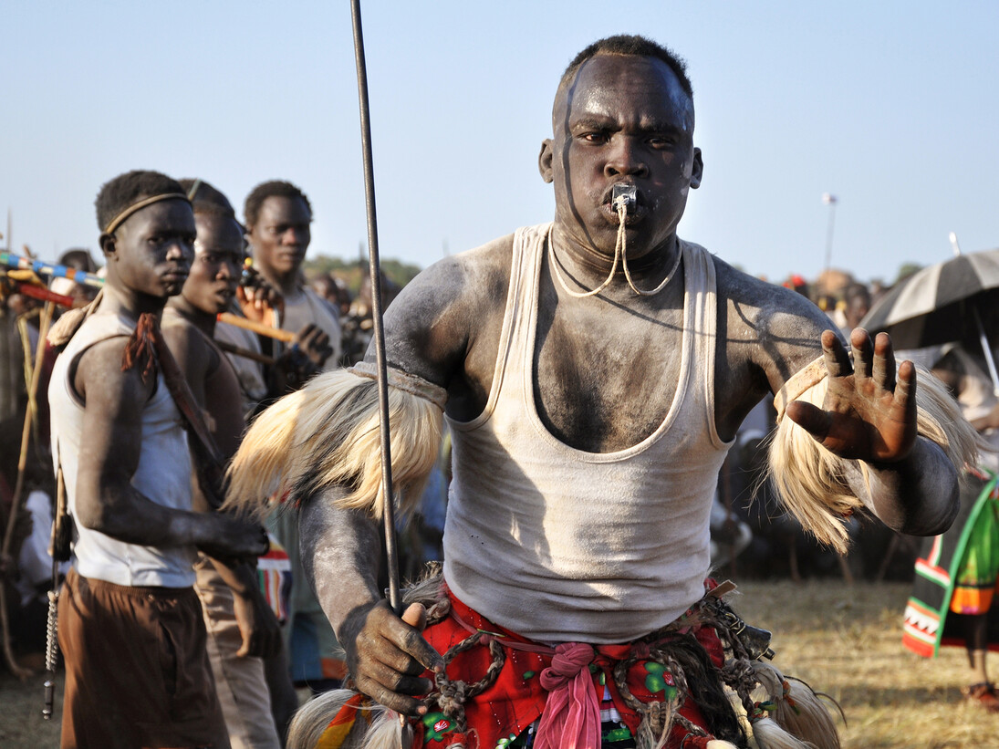 Enikö Nagy, A Ngolo-Nuba man challenges rivals at a suraa bout, an ancient wrestling tradition. 
In Fama, Nuba Mountains 