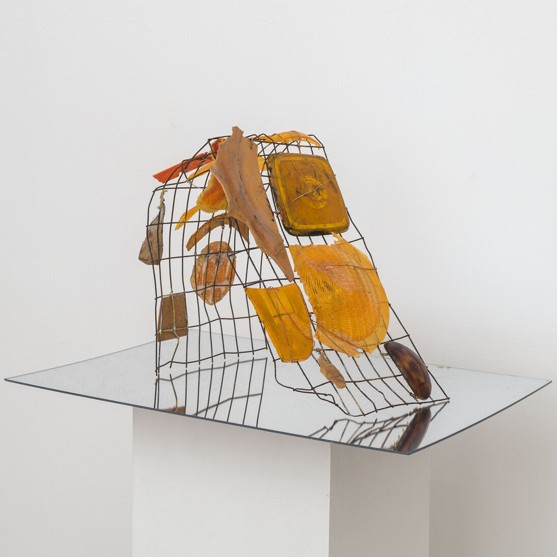 Elisa Lendvay, Orange Wave, 2014, Plastic fragments, plaster, acrylic paint, fabric, wire, mirrored Plexi base
14 x 13.5” x 10”