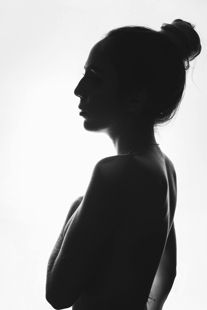 The lone silhouette of a girl reflects the struggle of identity in a world of shifting boundaries