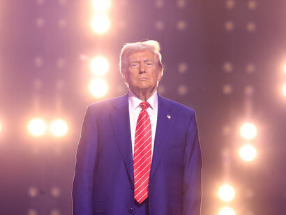 With the lights shining brightly on him, Trump's distant look mirrors his stance on global health and climate crises, as he pulls the U.S. away from international efforts