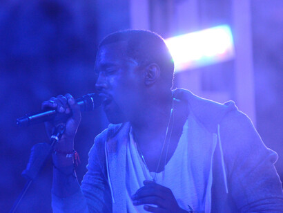 Kanye West performs atop a mountain set during The Yeezus Tour at the Verizon Center in Washington, D.C., on November 21, 2013