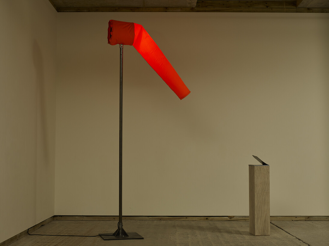 Fiona Banner, Agent Provocateur 2015, Heart of Darkness magazine, plinth with graphite, fabric windsock, electrically powered fan, LED light, mixer and stand, Dimensions variable, Courtesy the artist and Frith Street Gallery, London 