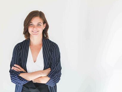 An intern smiling that she's found a place to start her professional career