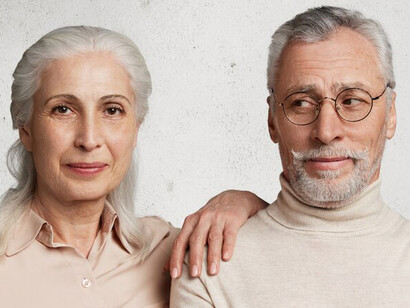 An elderly couple posing, exemplifying the beauty of aging gracefully through a healthy lifestyle