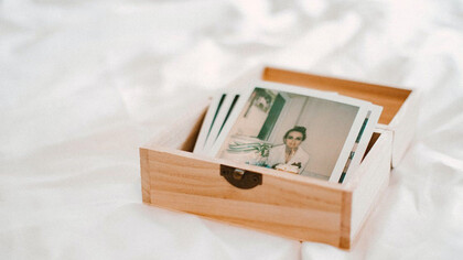 Close-up of pictures in a wooden box