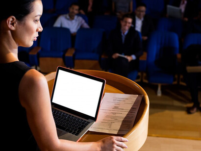 A female politician addressing a crowd, embodying the principles of democracy, representation, and the power of voice