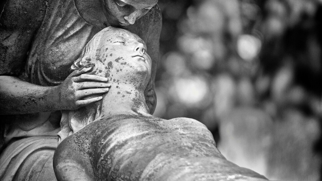 Black-and-white image of a guardian angel statue in Montréal, Quebec, Canada