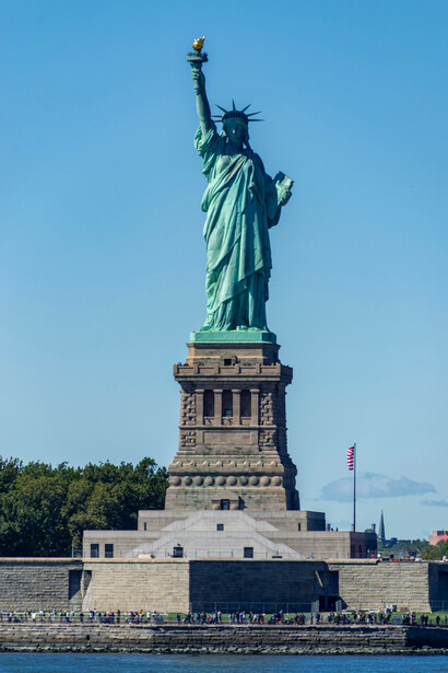 A bright, clear day over the Statue of Liberty in New York, USA