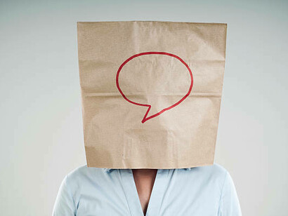 A person wearing a paper bag on their head