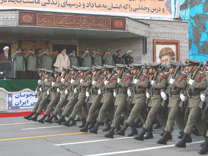 Ceremonial military march in Tehran, showcasing members of Iran's armed forces during a public parade