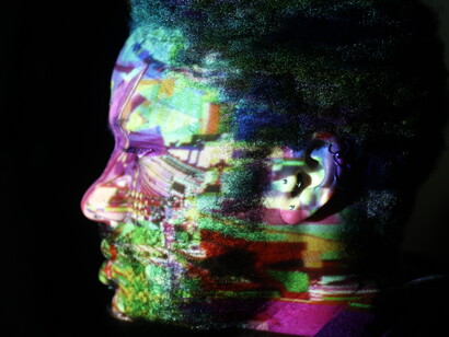 A surreal self-portrait shaped by glitch projections and fractured reflections, revealing the fragmented echoes of life online