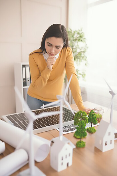 A woman engineer spearheads an eco-friendly project, emphasizing sustainable construction materials and innovative building designs