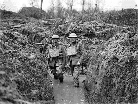 Lancashire Fusiliers in a flooded communication trench, showing wire. Opposite Messines, near Ploegsteert Wood. January 1917, © IWM