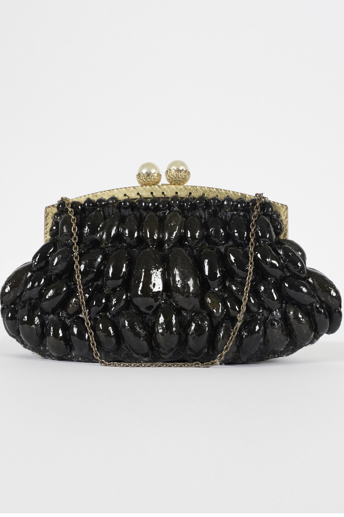 Deirdre Hayden, Mermaids Purse, 12 x 12 in, lambda c-print on metal, sculpture made from seaweed resin and found object