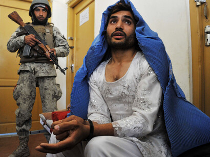 Arrested man in burka