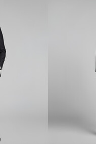 Male and female model stands side by side in suits, embodying genderless fashion