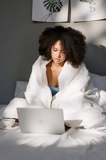 As the morning sun rises, a young woman instinctively reaches for her phone, dedicating her initial moments to scrolling—an activity that some might view as an inefficient use of time