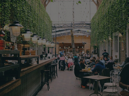 Diners enjoy the vibrant atmosphere of a restaurant in Budapest, Hungary
