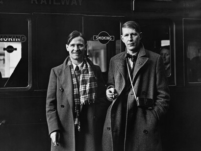 Authors W.H. Auden and Christopher Isherwood changing trains in Germany