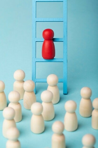 Business roles depicted through pawns, with a single red pawn highlighting distinction and leadership