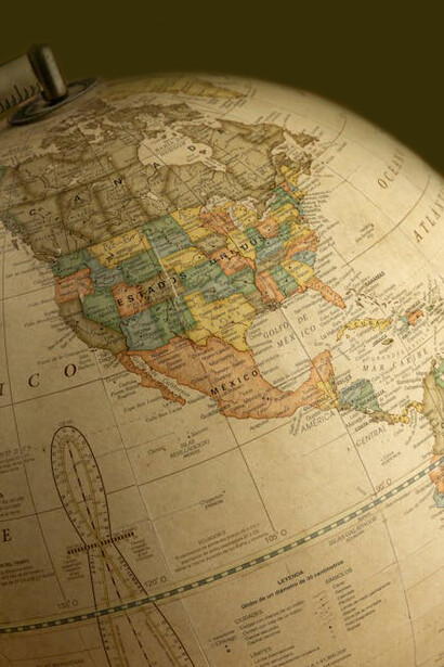 A world map or globe highlights the power of naming, cartography, and the impact of geopolitical maps in shaping global perceptions