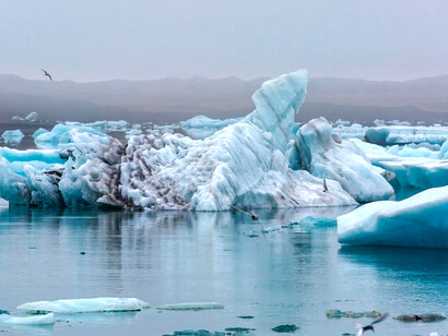 Ice and snow breaking along a sea coast, a stark reminder of global warming and the accelerating melt of Earth’s frozen regions