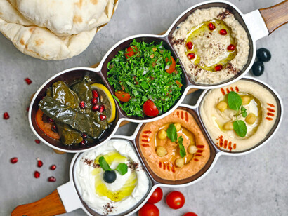 A collection of Middle Eastern dishes served in small bowls