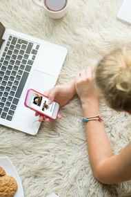 A teenage girl scrolling through social media—highlighting the mental health impact of screen time