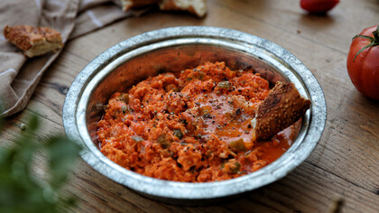 A delectable serving of menemen is elegantly presented on the table