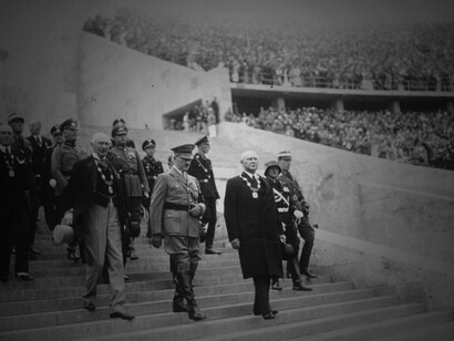 Adolf Hitler enters the Berlin Olympic Stadium through the Marathon Gate before the ceremonial opening of the 1936 XI Olympic Games, accompanied by Count Henri de Baillet-Latour, President of the International Olympic Committee, and Theodor Lewald, President of the German Olympic Committee