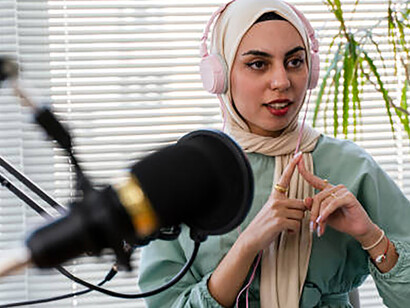 The live podcast becomes a nexus of cultural exchange, as an engaging interview and enlightening discussion unfold between a perceptive blogger and a Muslim woman guest