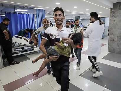 Wounded Palestinians anxiously await medical attention in the overcrowded emergency ward of Al-Shifa Hospital in Gaza City, a scene resulting from the aftermath of an Israeli airstrike on October 11, 2023