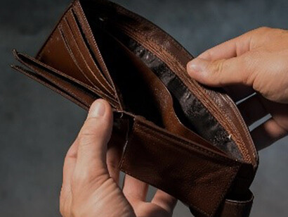 An empty wallet symbolizes the stark reality of the living cost crisis