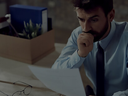 Worried businessman going through paperwork