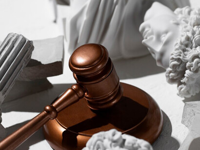 Scales of justice on a clean white surface