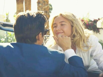 Florence Pugh smiling in a scene from the film Don't Worry Darling directed by Olivia Wilde