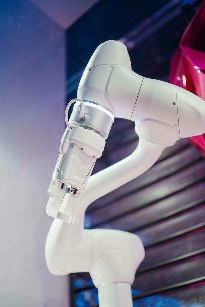 Combining AI and floral design, the installation features industrial robot arms precisely picking flowers and handing over plastic roses as part of a mesmerizing robotic rose-picking display