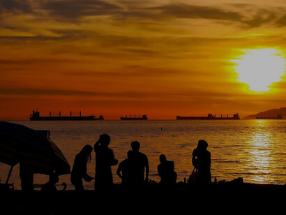 Friends on the beach at sunset