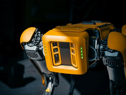 A close-up side view of a Boston Dynamics Spot robot, showcasing AI-powered robotics and the evolution of intelligence