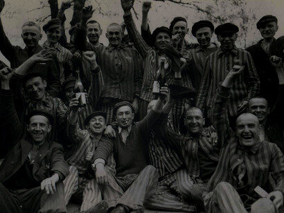 Jews celebrating liberation from the Nazi Regime. "The liberation of Dachau" by American photographer Margaret Bourke-White,1945. Courtesy of the United States Holocaust Memorial Museum in Washington D.C., USA