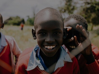 Three boys smiling during daytime by Bennett Tobias