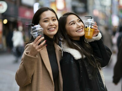 Japanese women in modest, functional attire, reflecting the balance between individuality and collective identity