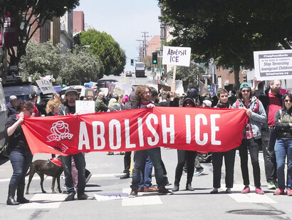 Activists from the Democratic Socialists of America hold a banner reading "Abolish ICE" at a protest in San Francisco denouncing Trump Administration's zero tolerance and family separation policies on June 19, 2018