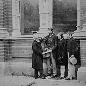Henry Cole, Francis Fowke, Godfrey Sykes and John Liddell in front of the residences range, photograph possibly by Charles Thurston Thompson, about 1863. Museum no. E.1086-1989. © Victoria and Albert Museum, London