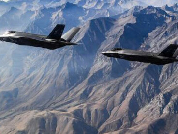 Two Lockheed Martin F-35 Lightning II fighter jets assigned to the Argonauts of Strike Fighter Squadron (VFA) 147 fly in formation during a photo exercise over Lemoore, California, on Nov. 16, 2018