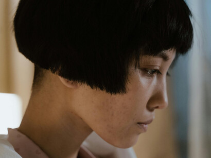 Close up of a young woman's face, deep in thought