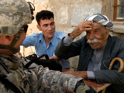 Kurdish people and an american soldier