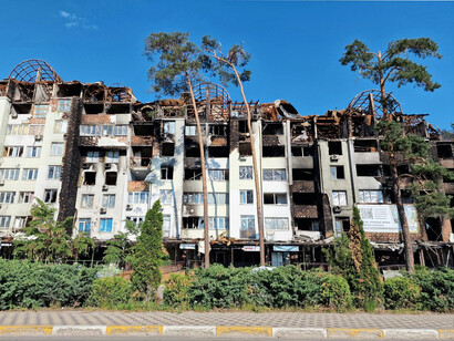 A bomb-scarred residential block in Ukraine, representing the devastating human cost of modern warfare on civilian life