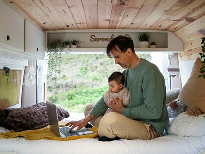 A family living in nature and traveling in a campervan, experiencing the joys of a road trip with a baby
